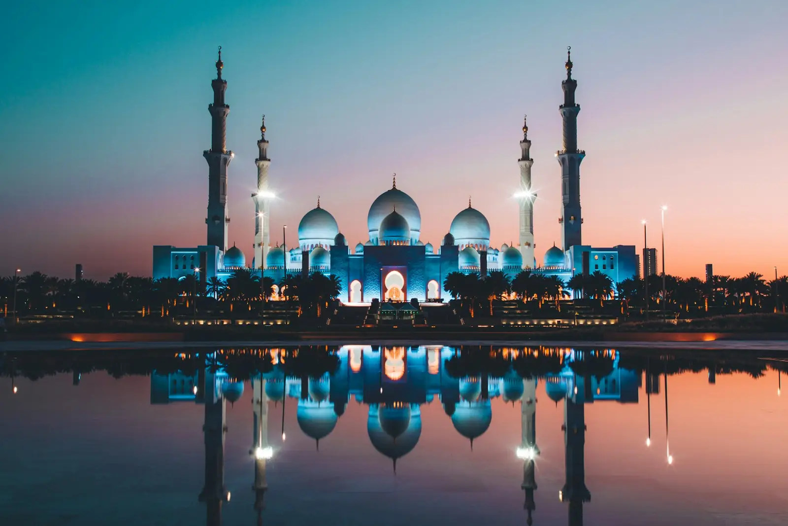 Sheikh Zayed Grand Mosque reflected at dusk